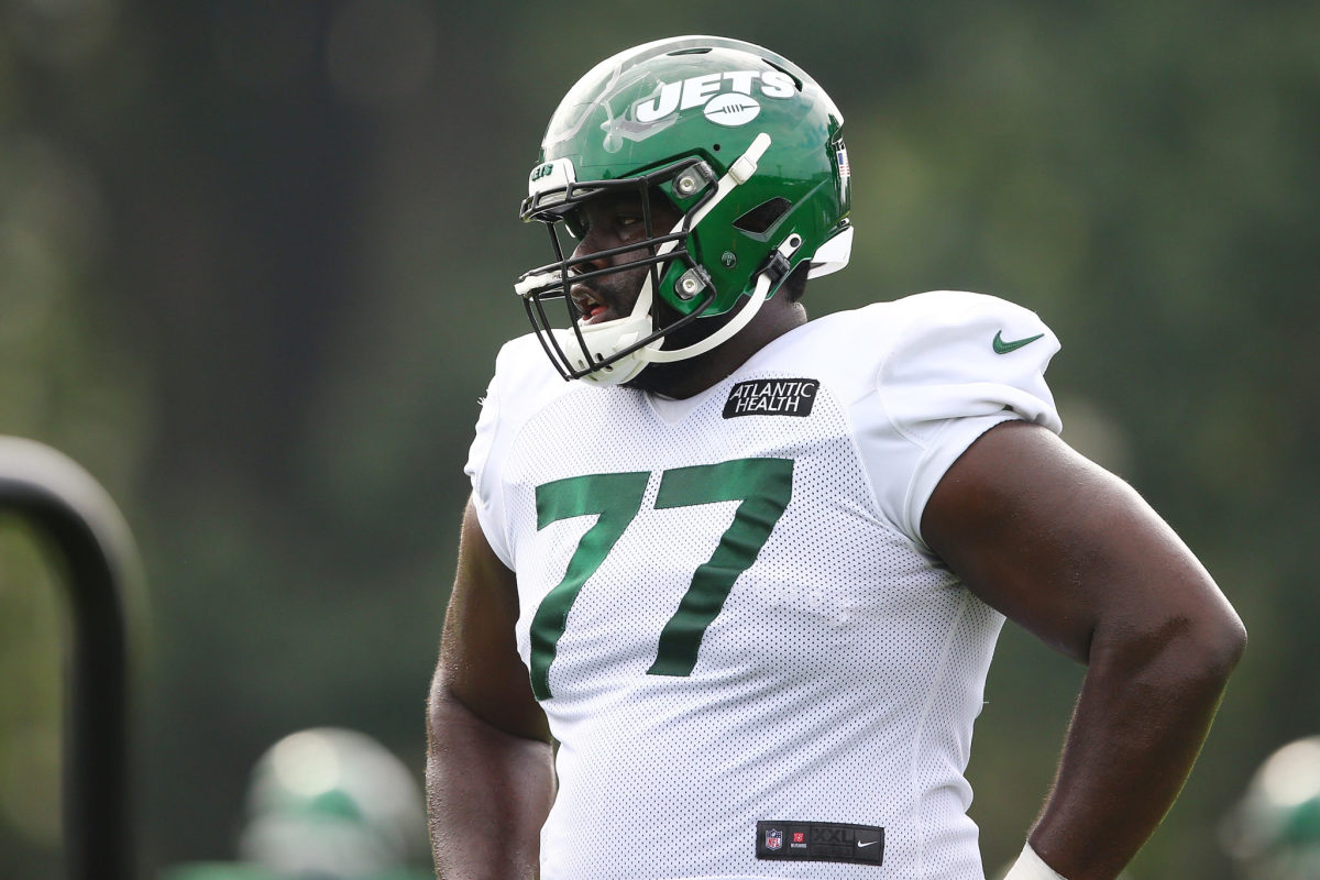 Mekhi Becton stands at New York Jets practice.