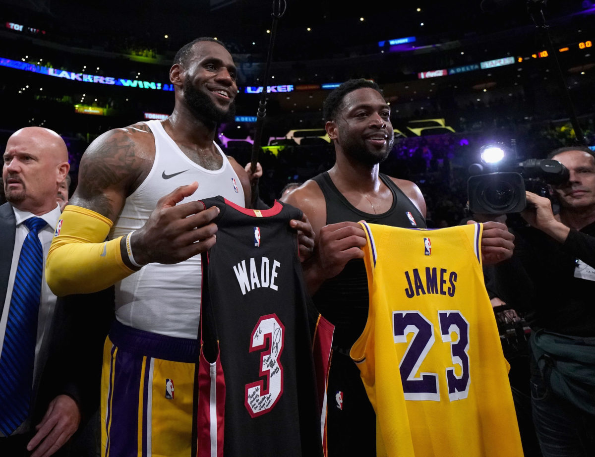 Dwyane Wade and LeBron James exchanging jerseys.