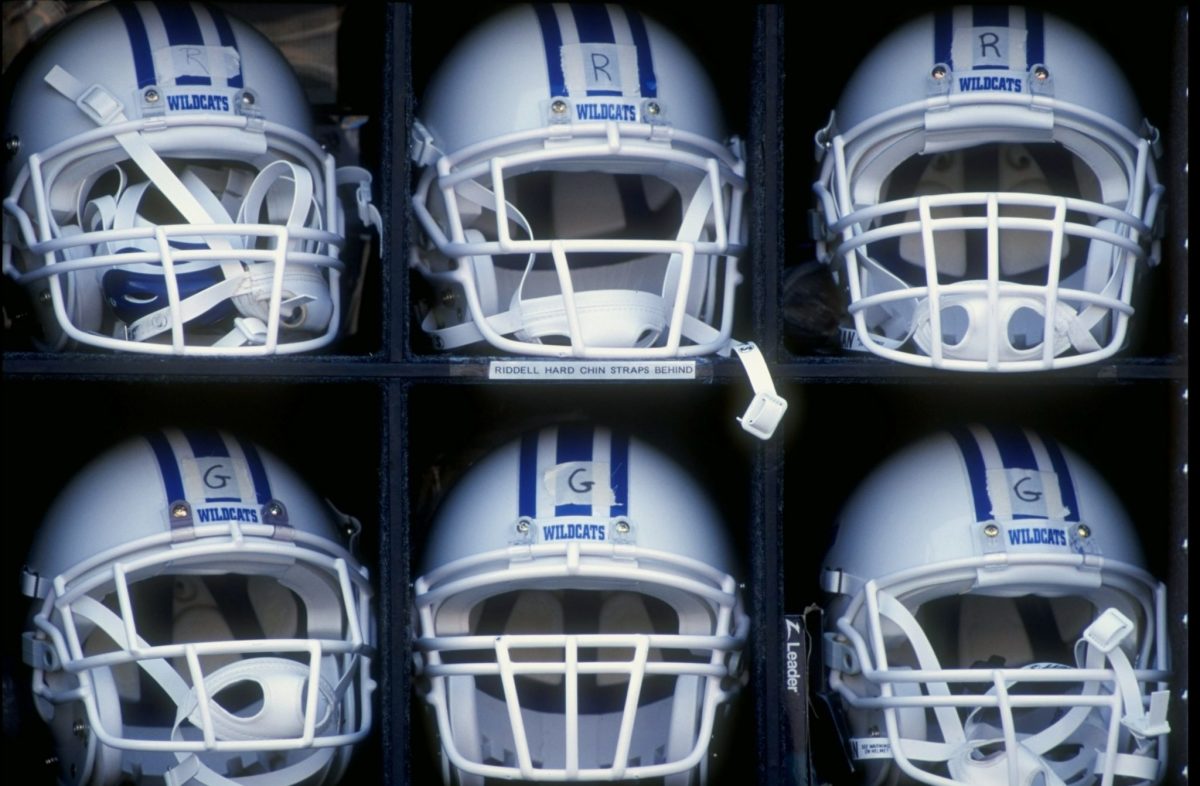 A closeup of white Kentucky helmets.