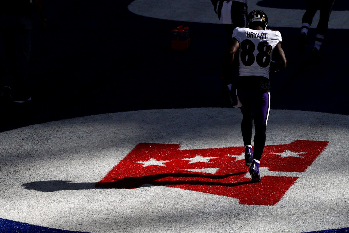 Ravens wide receiver Dez Bryant runs in the end zone before a game.