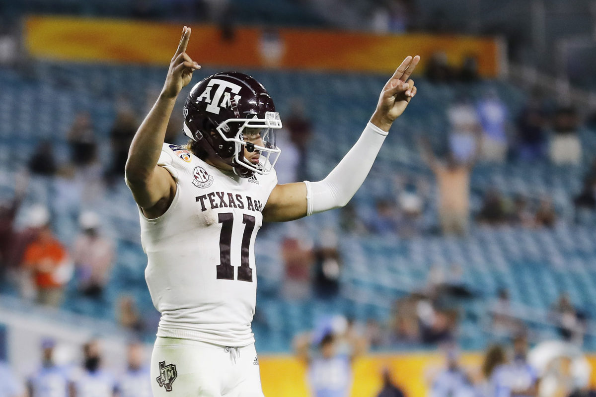 Kellen Mond #11 of the Texas A&M Aggies celebrates after a touchdown. He is a 2021 NFL Draft prospect.