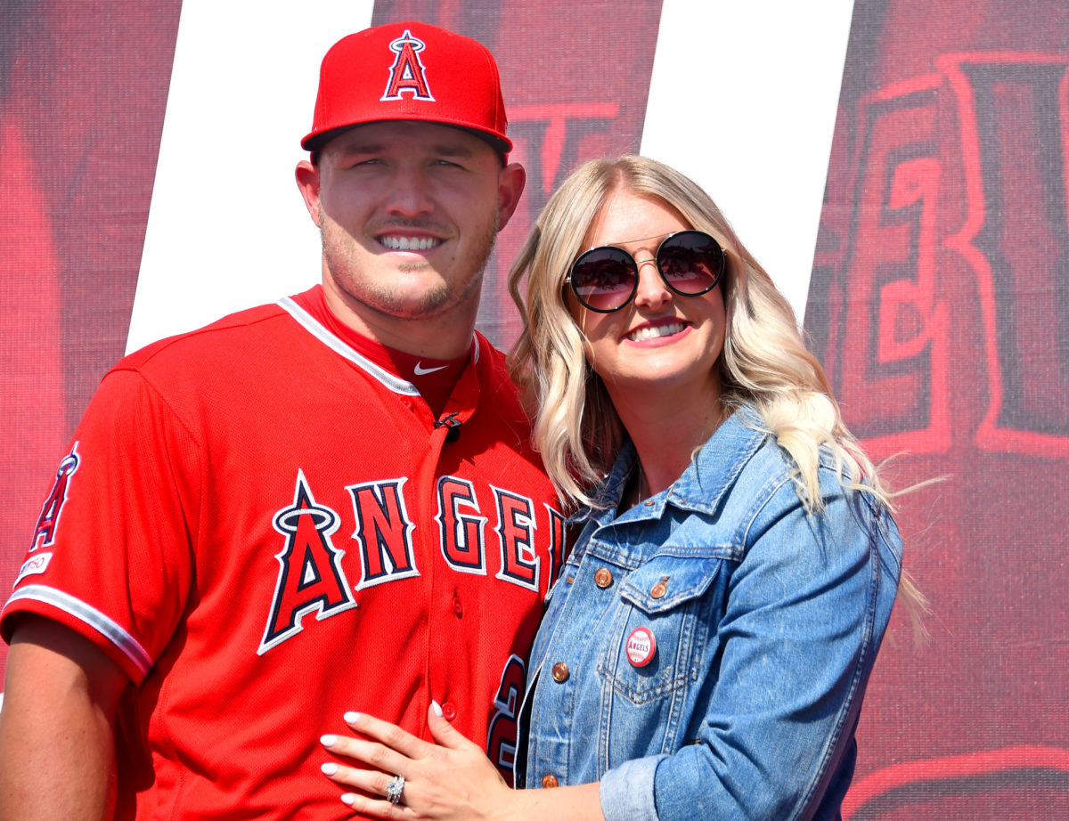 Mike Trout and his wife, Jessica, at a press conference.