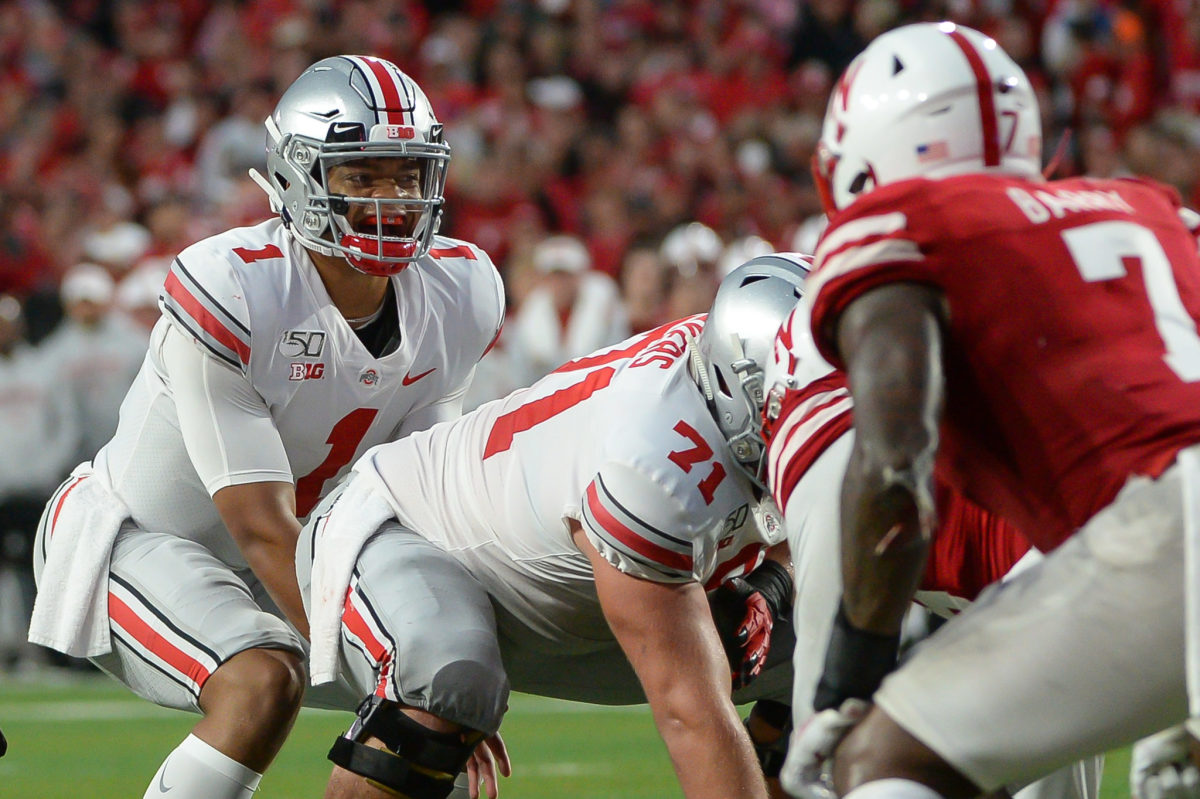 Ohio State quarterback Justin Fields takes a snap against Nebraska during a 2019 college football game.