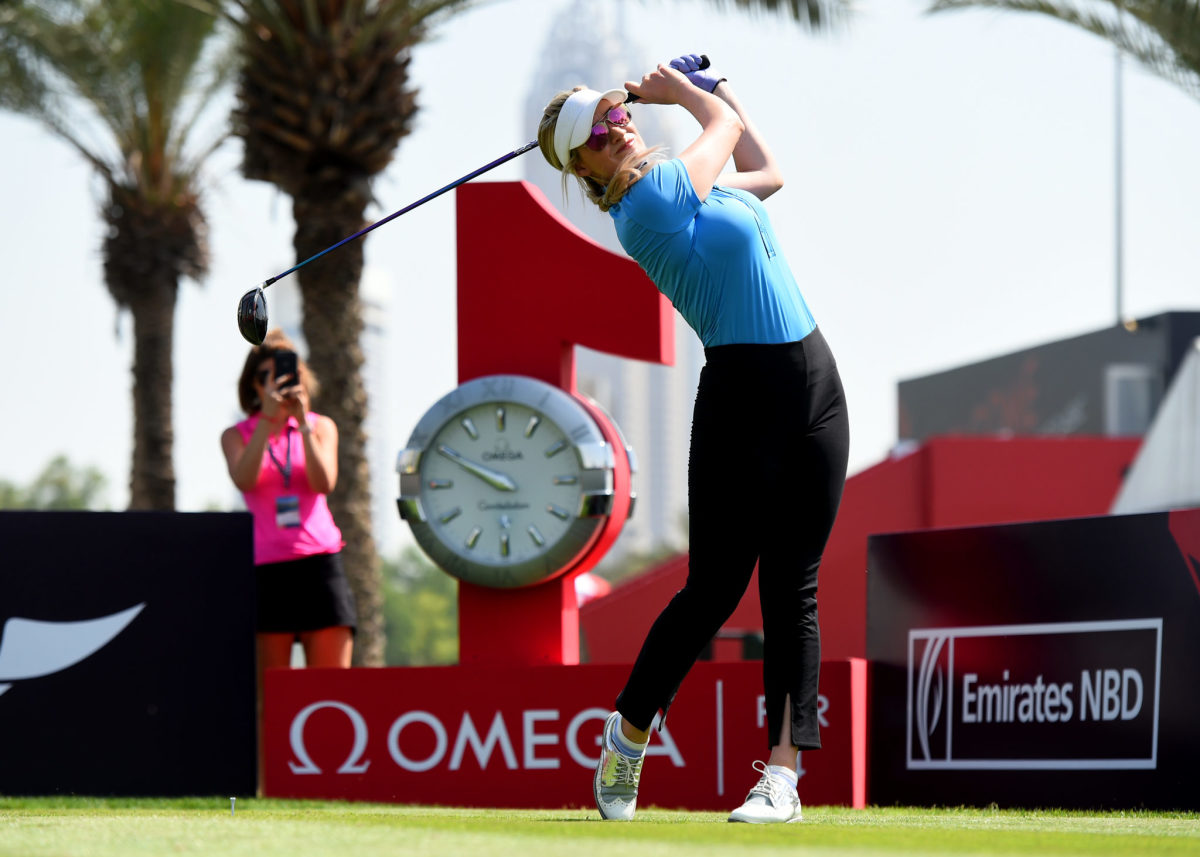 Paige Spiranac tees off.