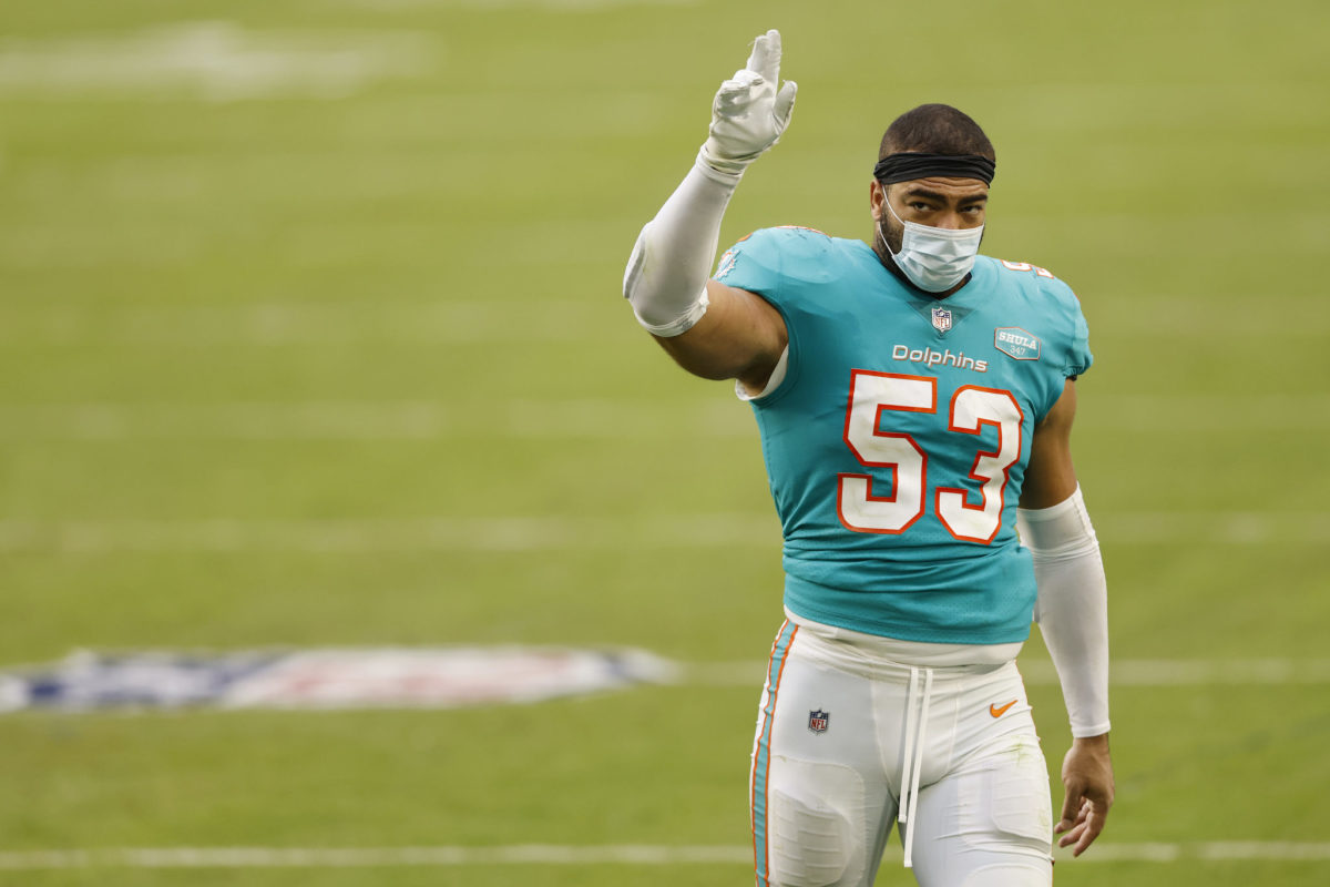 Miami Dolphins linebacker Kyle Van Noy acknowledges the crowd walking off the field.