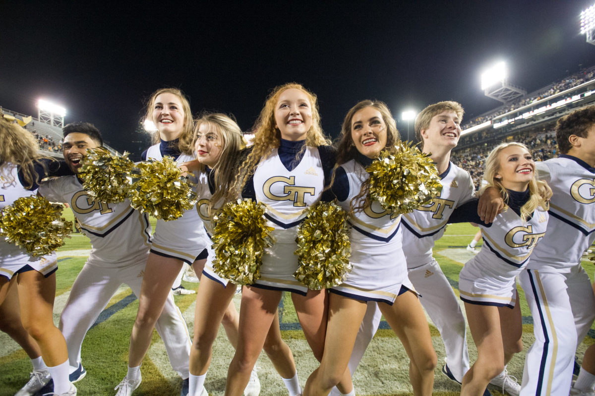 Georgia Tech cheerleaders performing during a football game.