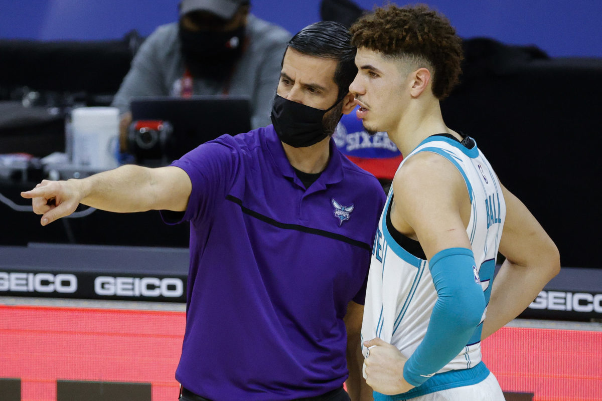 Head coach James Borrego and LaMelo Ball #2 of the Charlotte Hornets speak on the sidelines
