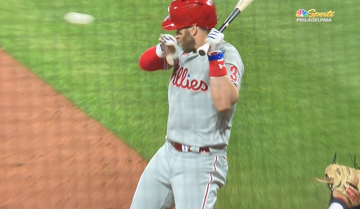 Bryce Harper gets hit in the head.