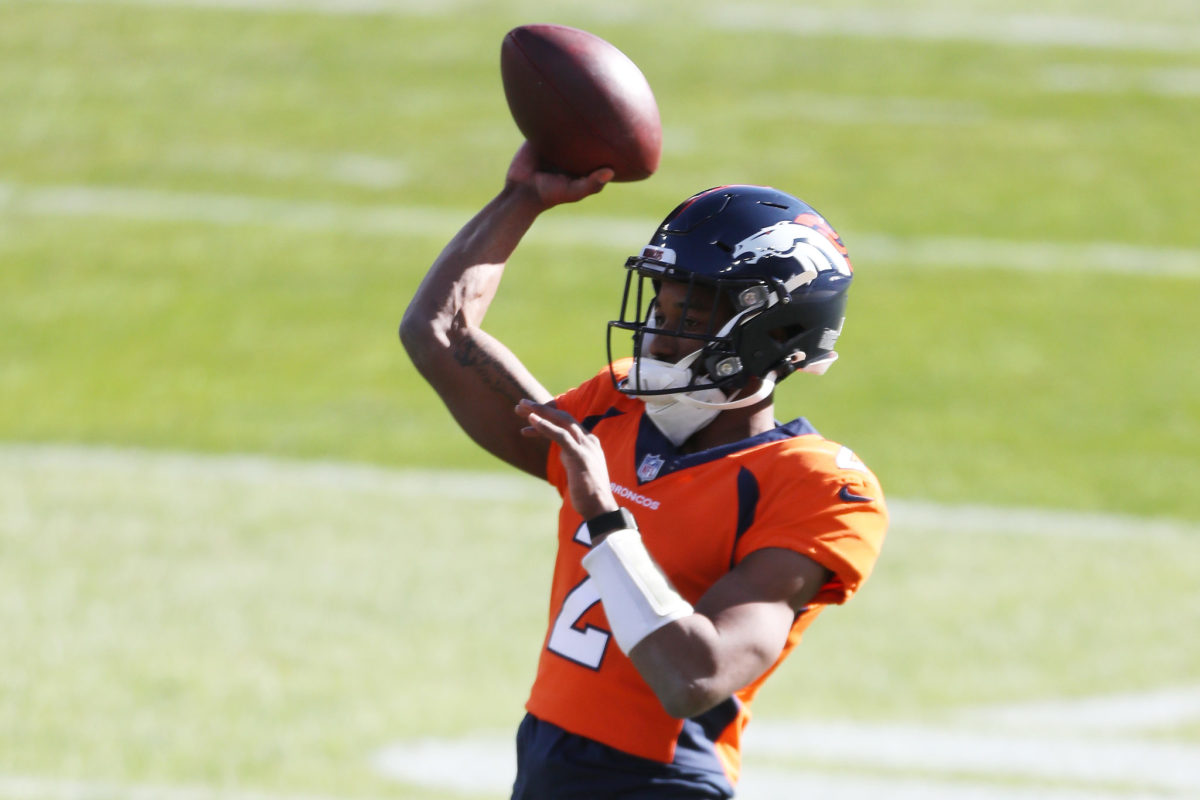 Kendall Hinton warming up at QB for the Broncos.