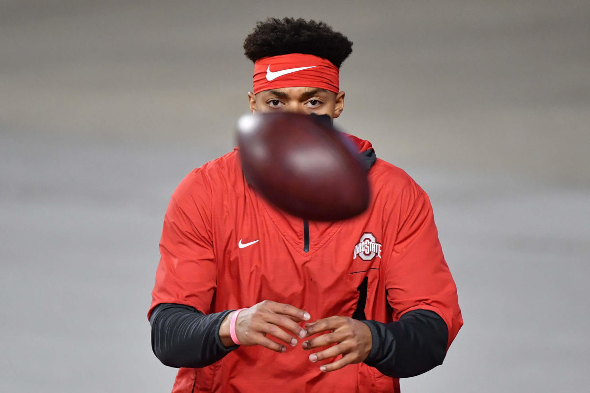 Ohio State quarterback Justin Fields warms up before a game. He was drafted by the Chicago Bears in 2021.