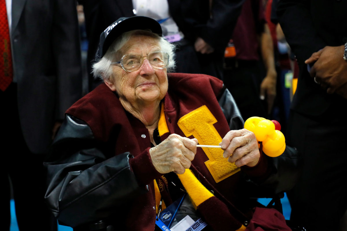 Loyola-Chicago basketball team chaplain Sister Jean sitting courtside during a game.