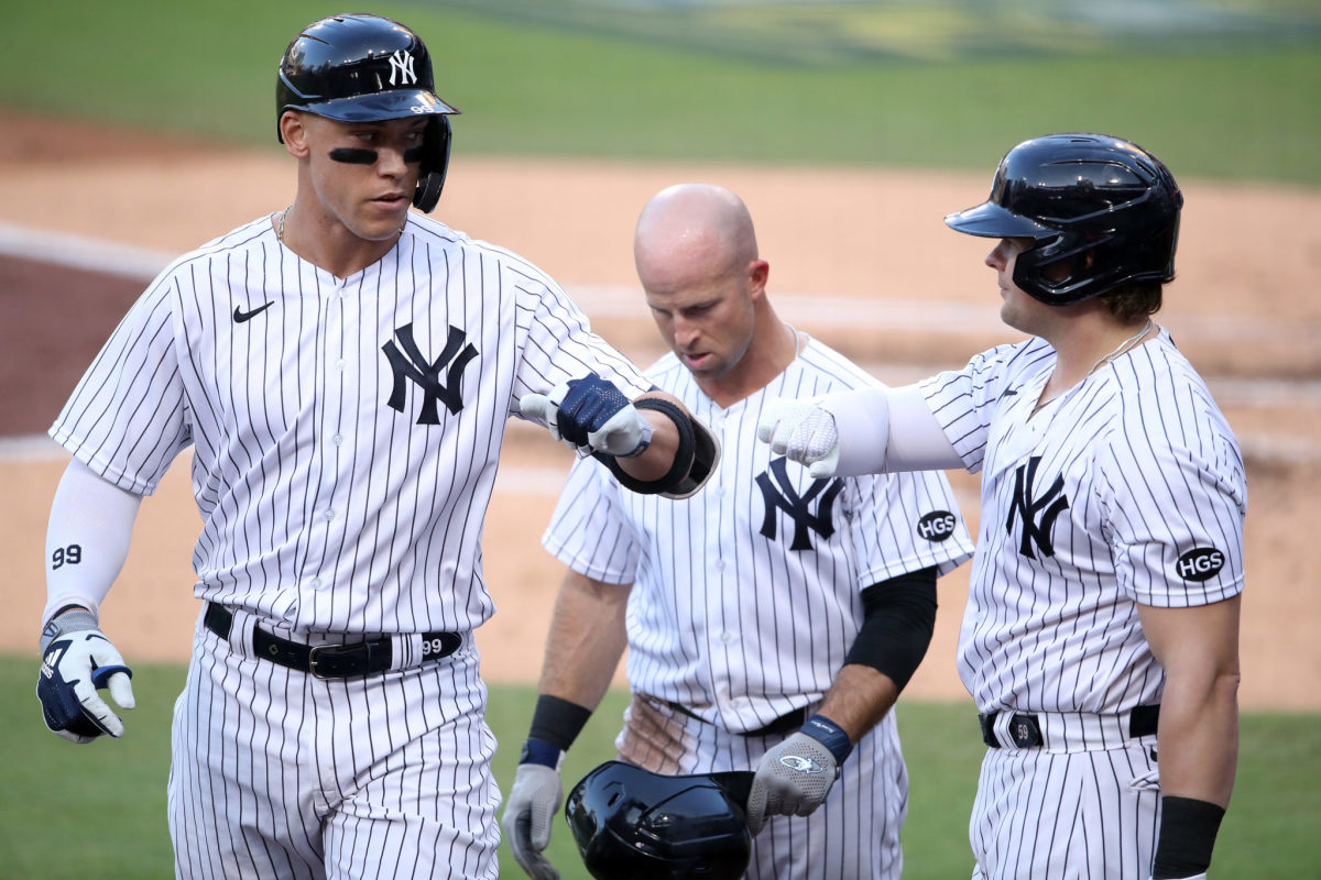 Luke Voit and Aaron Judge congratulate each other.