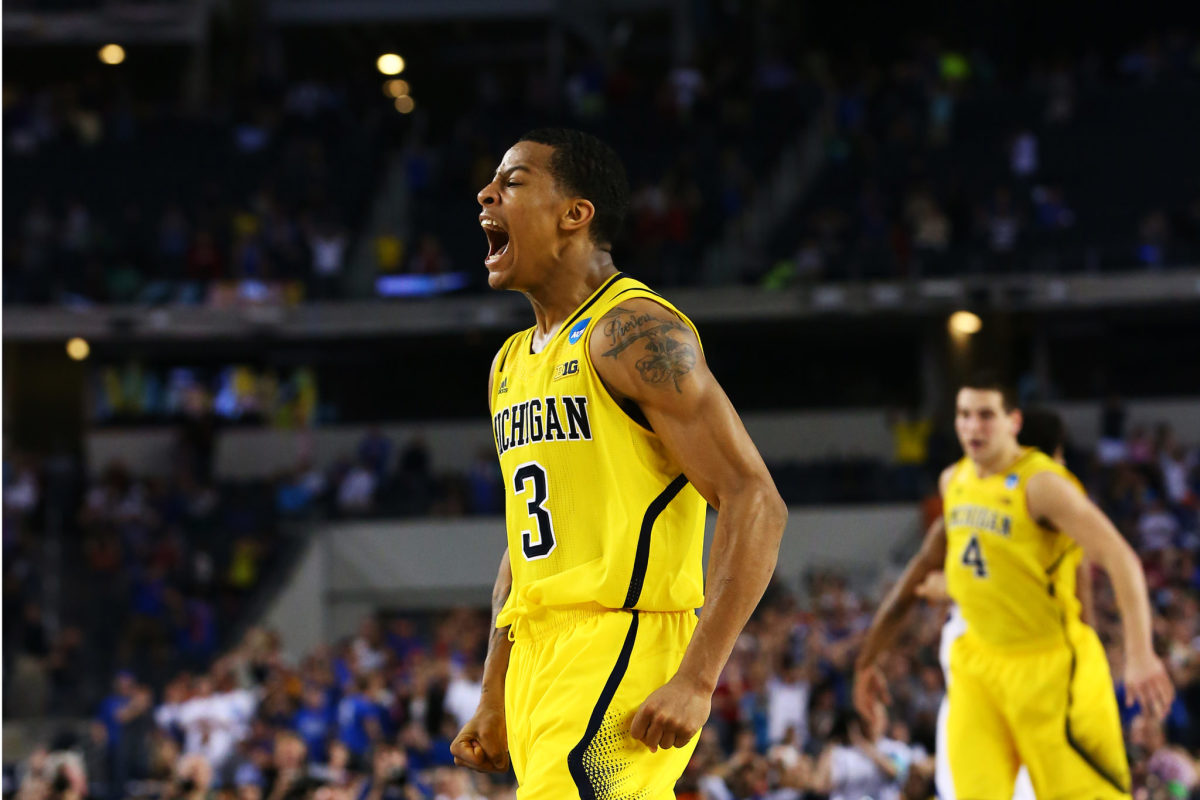 Trey Burke of the Michigan Wolverines reacts after shooting a game-tying three-pointer.