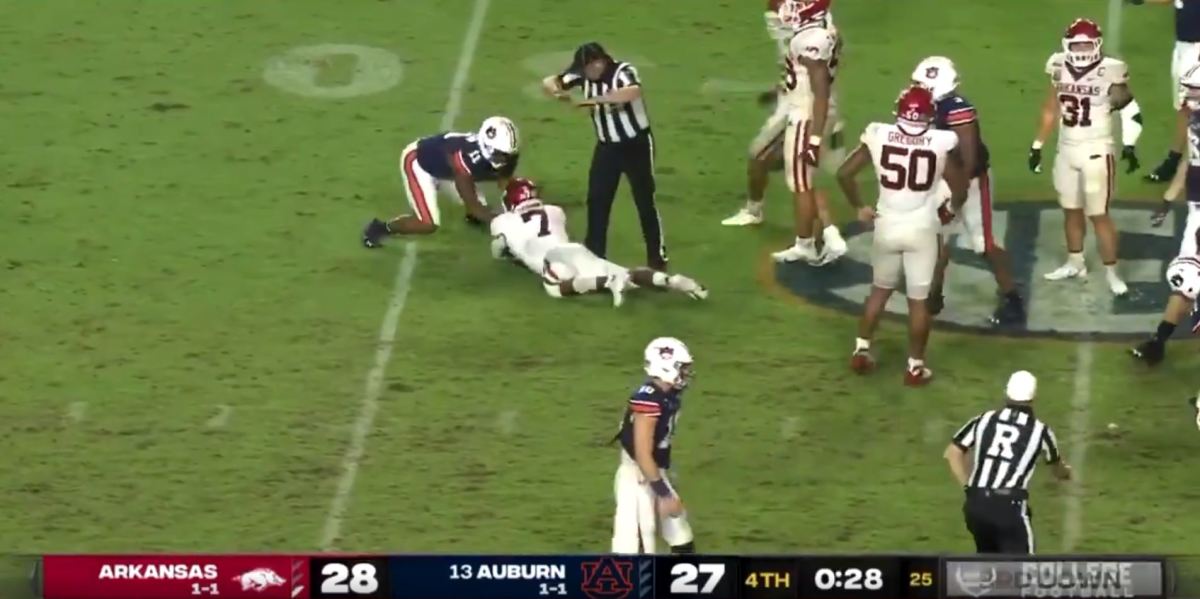 Arkansas football recovers a fumble against Auburn, but after the play was blown dead.