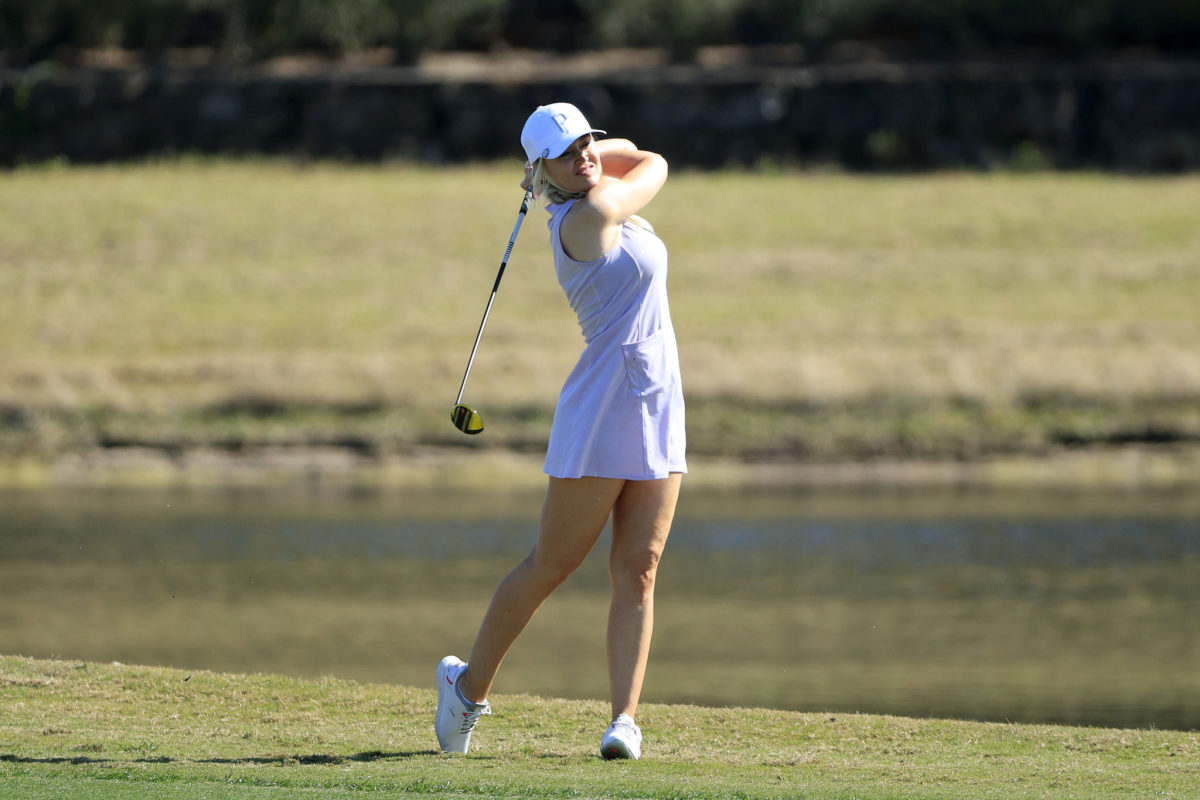 Blair O'Neal swings during a 2021 golf tournament.
