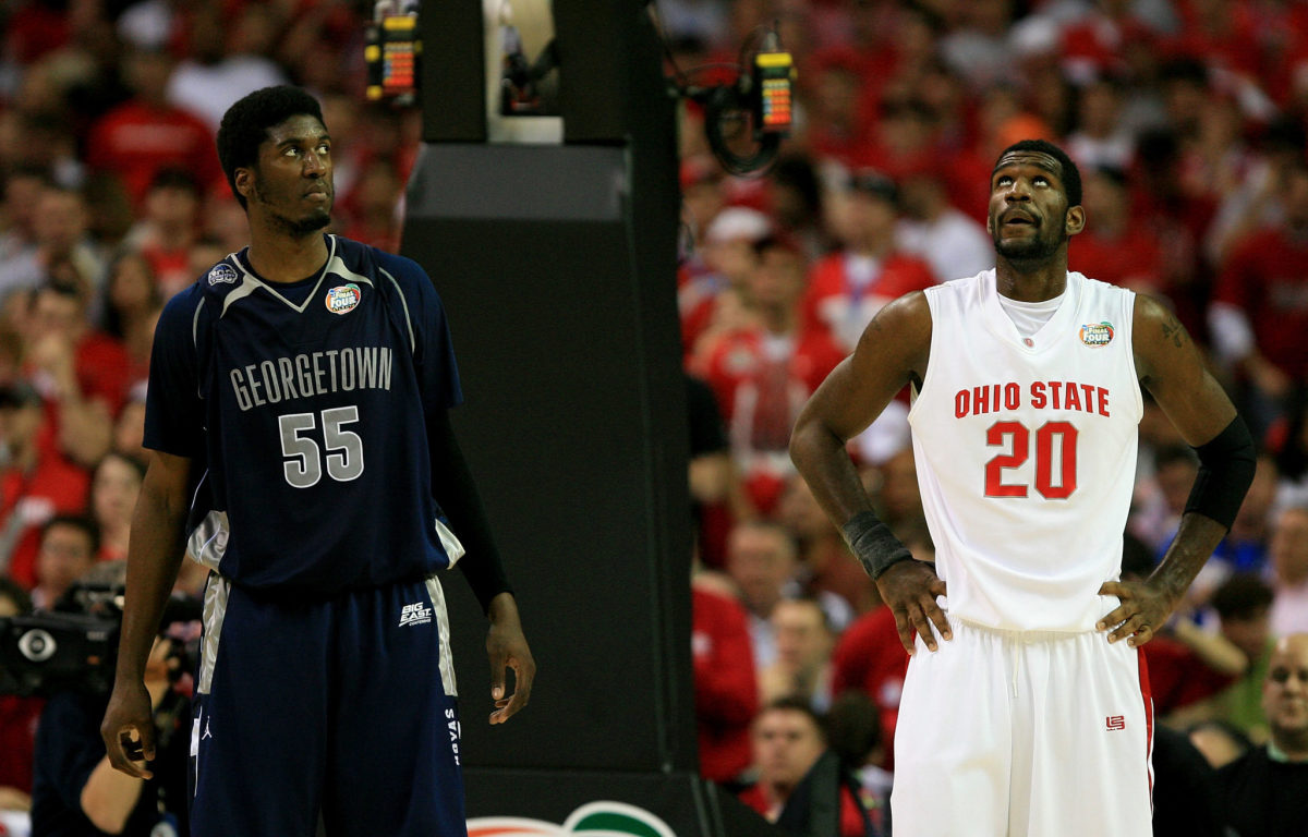 Greg Oden and Roy Hibbert standing side-by-side in a college basketball game.