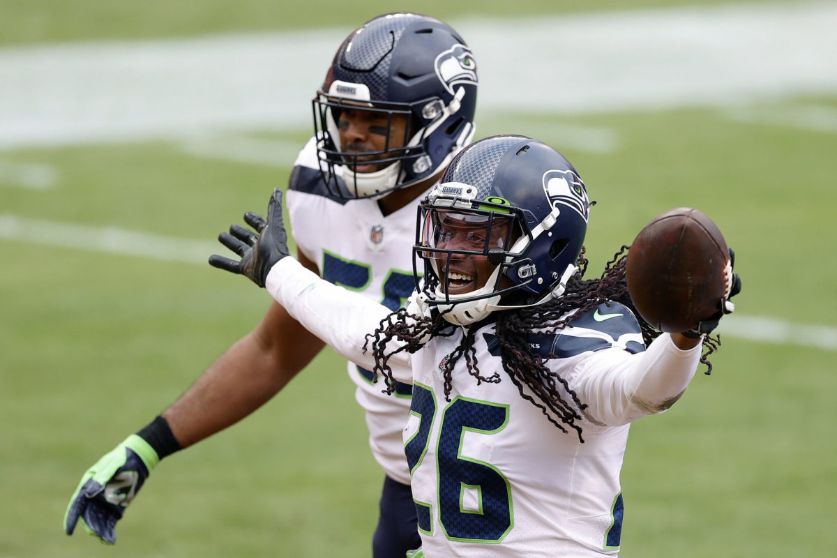 Two Seahawks players celebrate a big play.