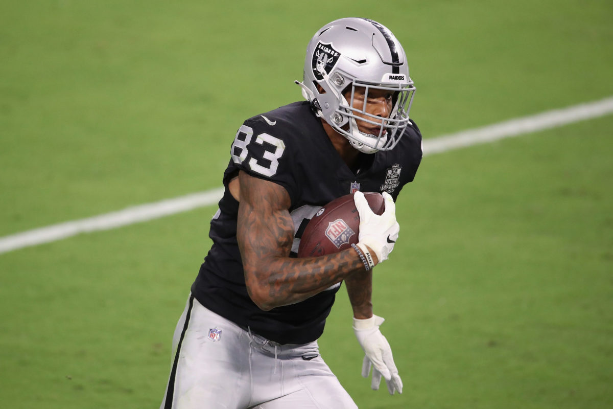 Darren Waller of the Raiders runs with the football.