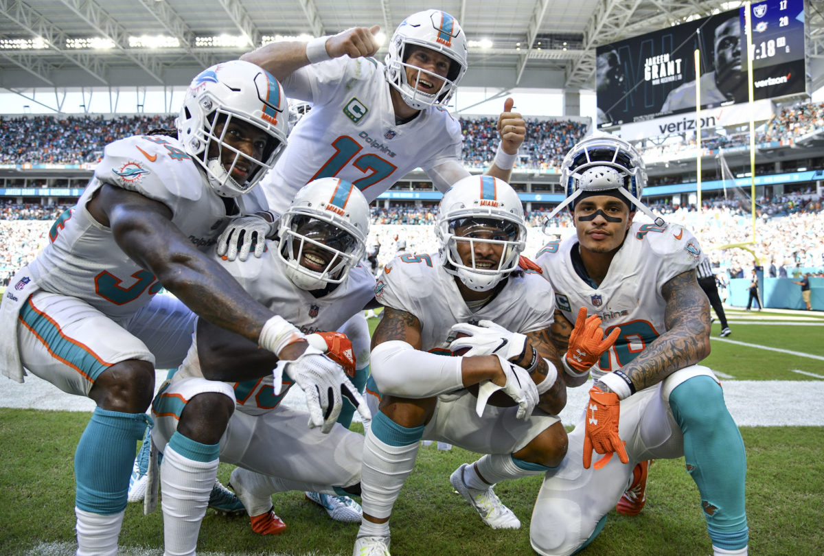 Members of the Miami Dolphins celebrating a TD.