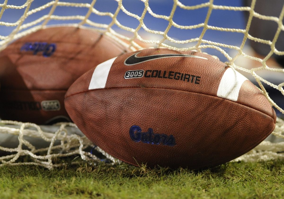 Two footballs with the Florida Gators logo on them.