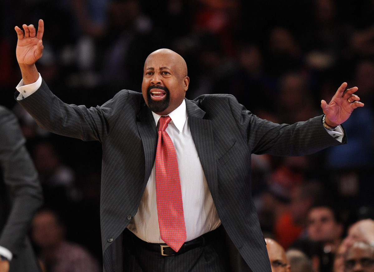 Mike Woodson gestures on the sideline while coaching a game.