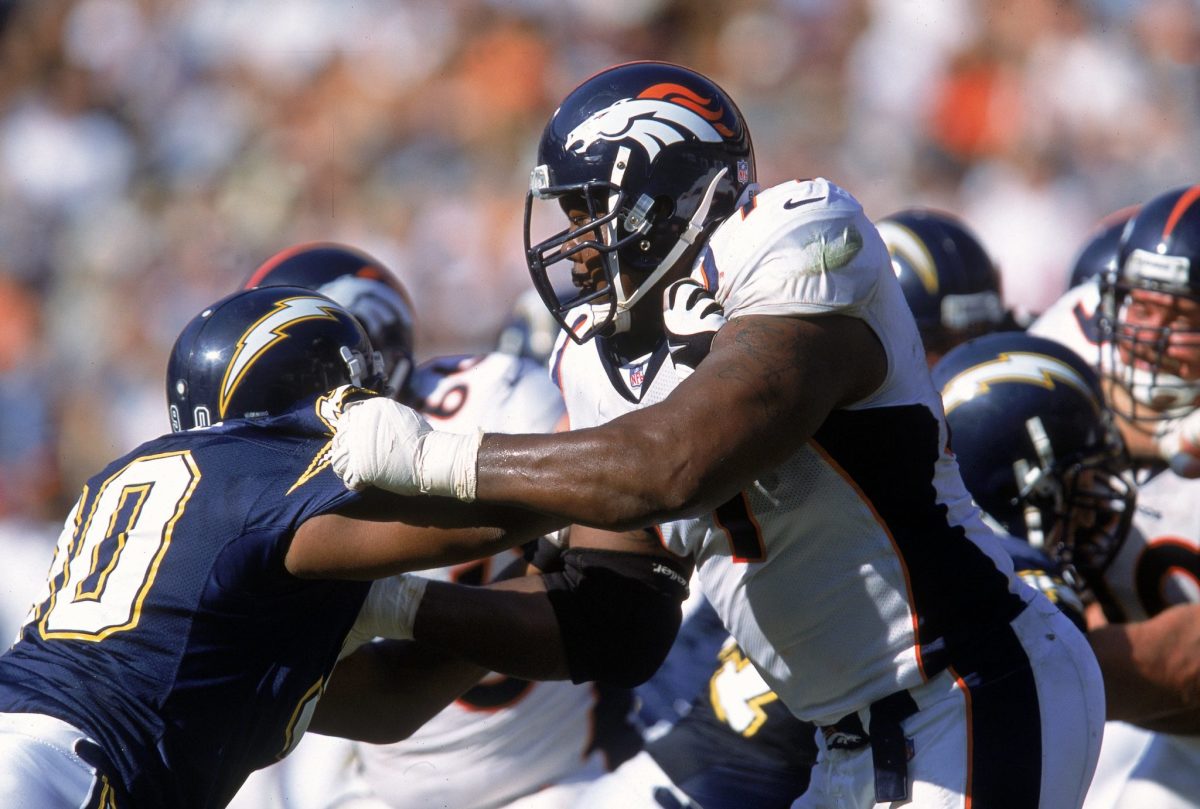 Denver Broncos lineman Tony Jones blocks a member of the San Diego Chargers.