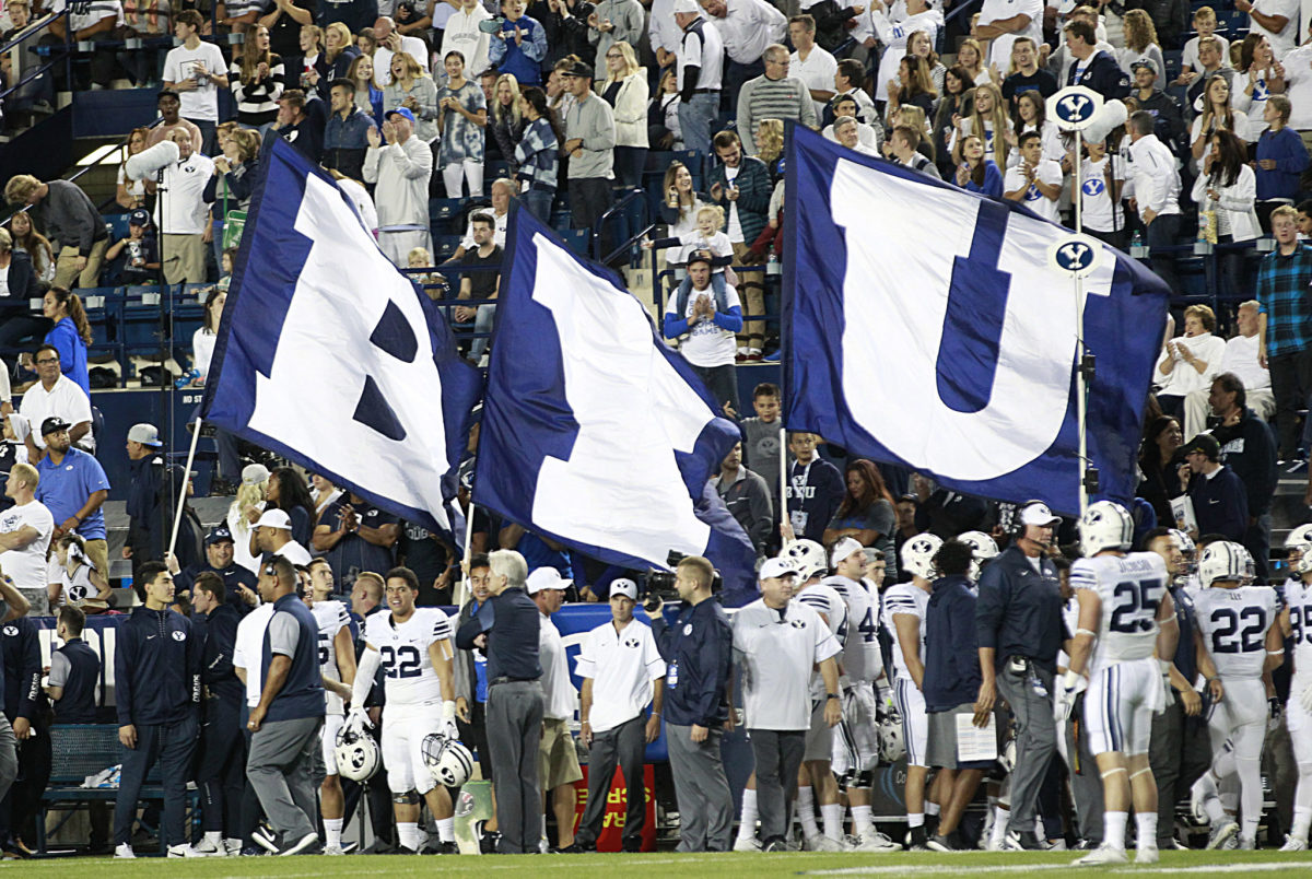 Three flags that spell out B-Y-U at a BYU football game.