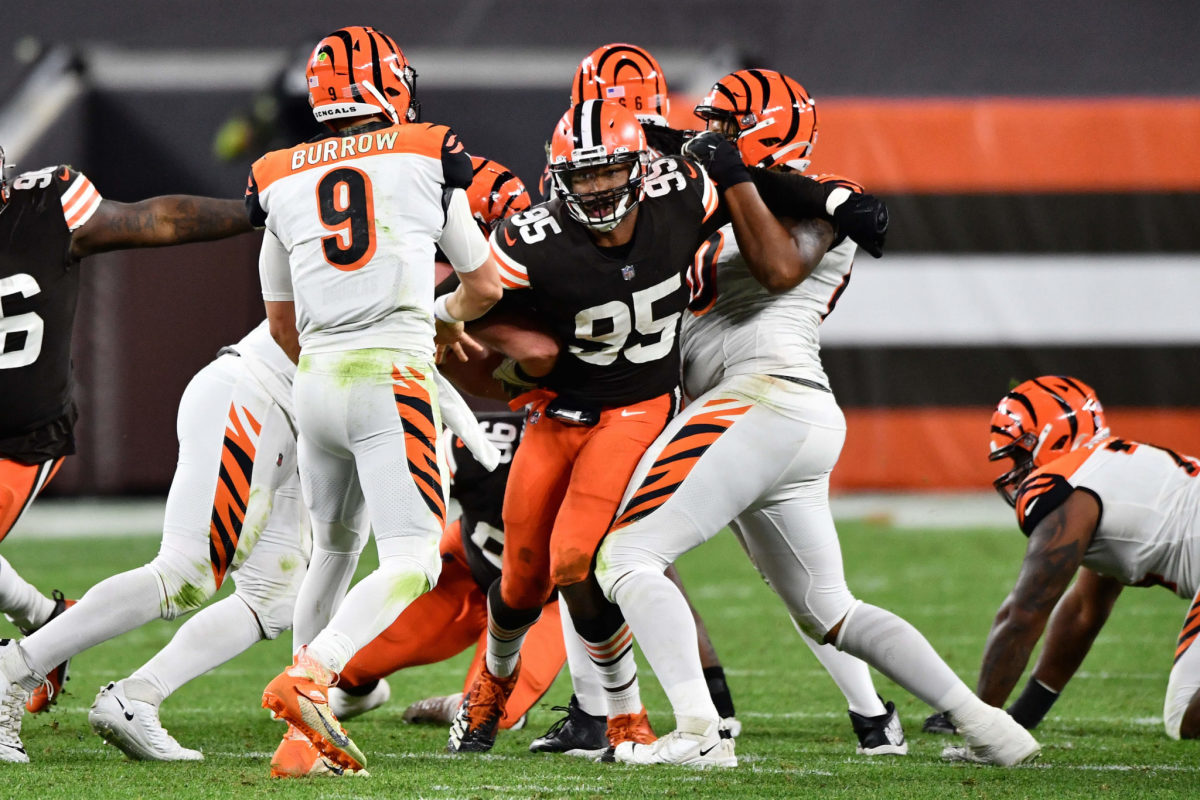 Cleveland Browns defensive end Myles Garrett pursues Cincinnati Bengals quarterback Joe Burrow during 2020 game.