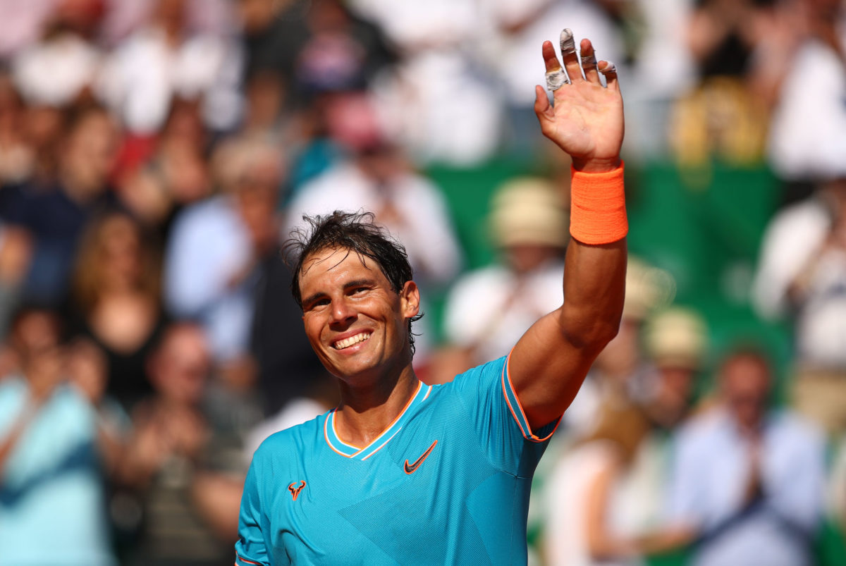 Rafael Nadal waving to fans after a match.