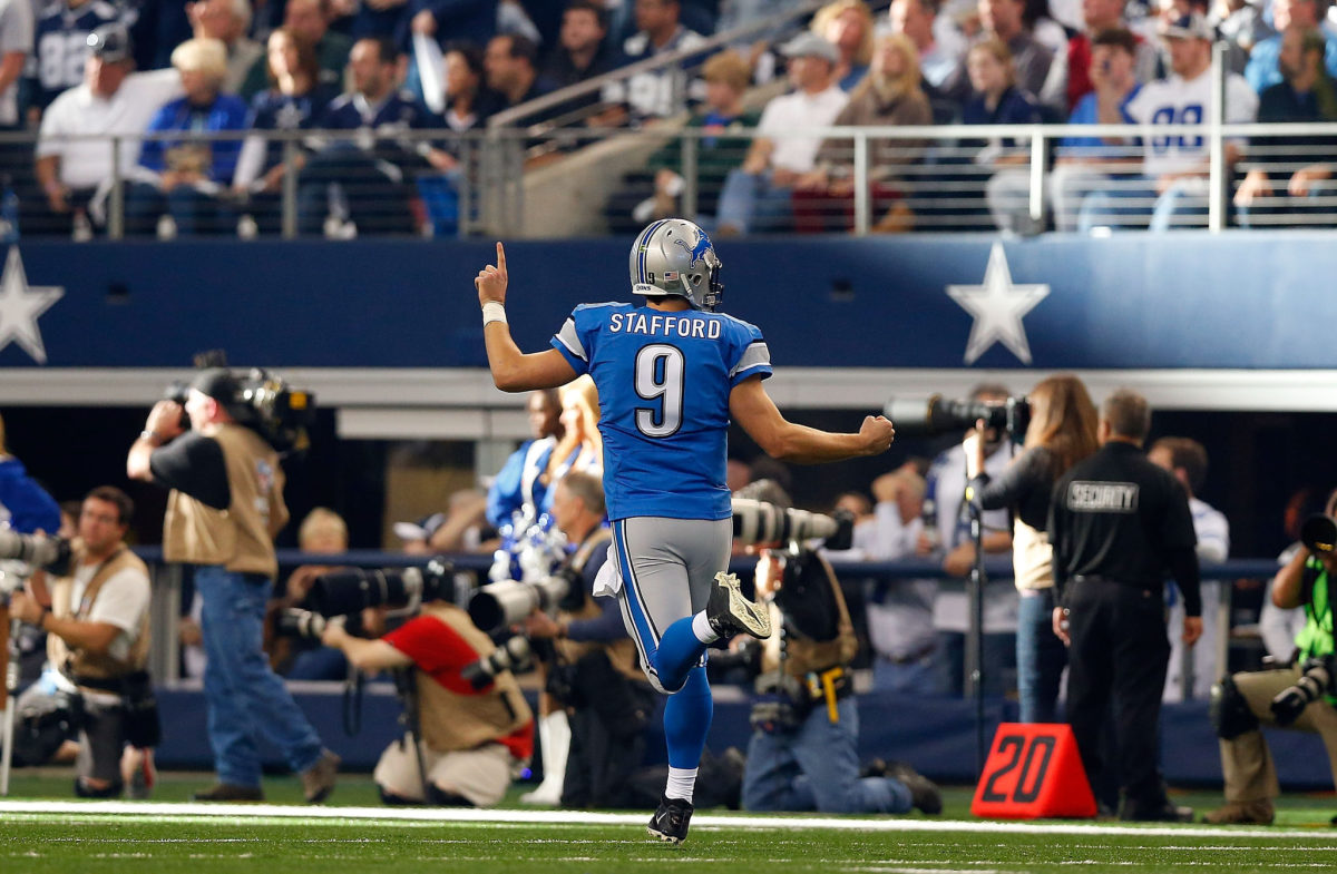 Matthew Stafford celebrates a play against the Dallas Cowboys at AT&T Stadium.