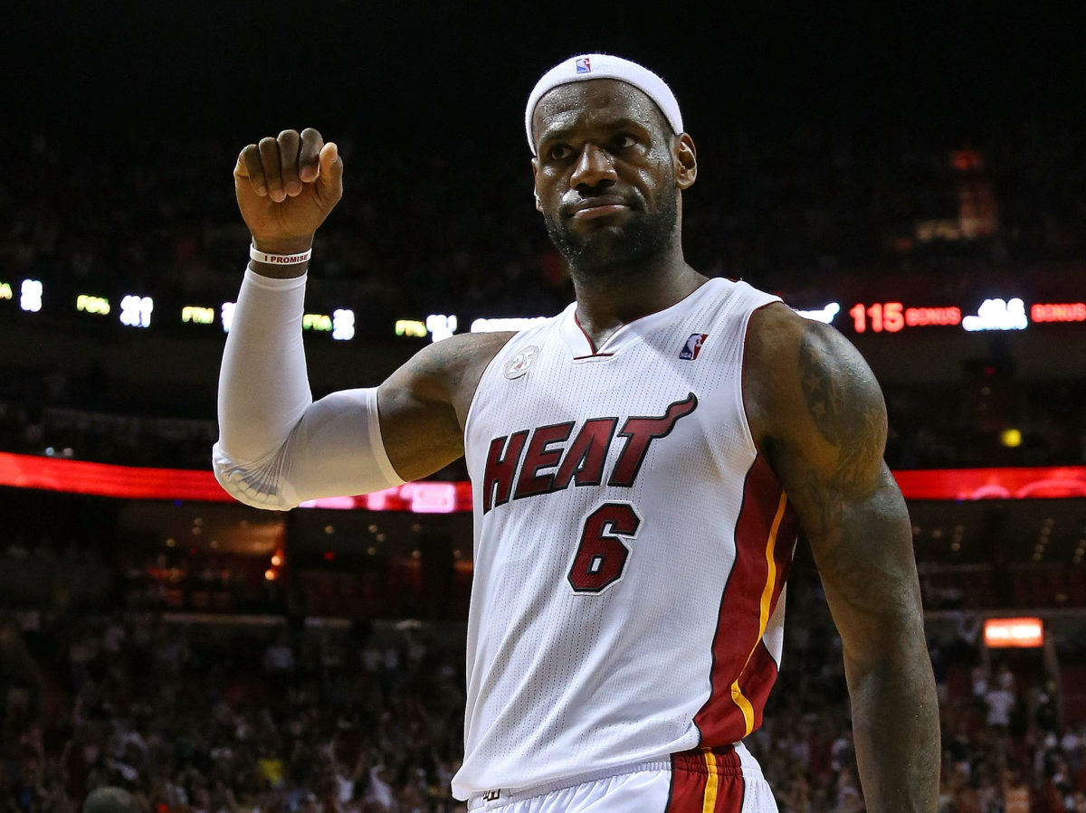 LeBron James raising his fist in a Miami Heat jersey.