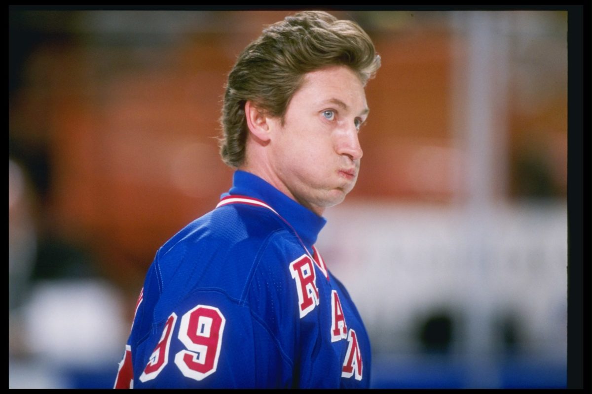 A helmetless Wayne Gretzky on the ice.