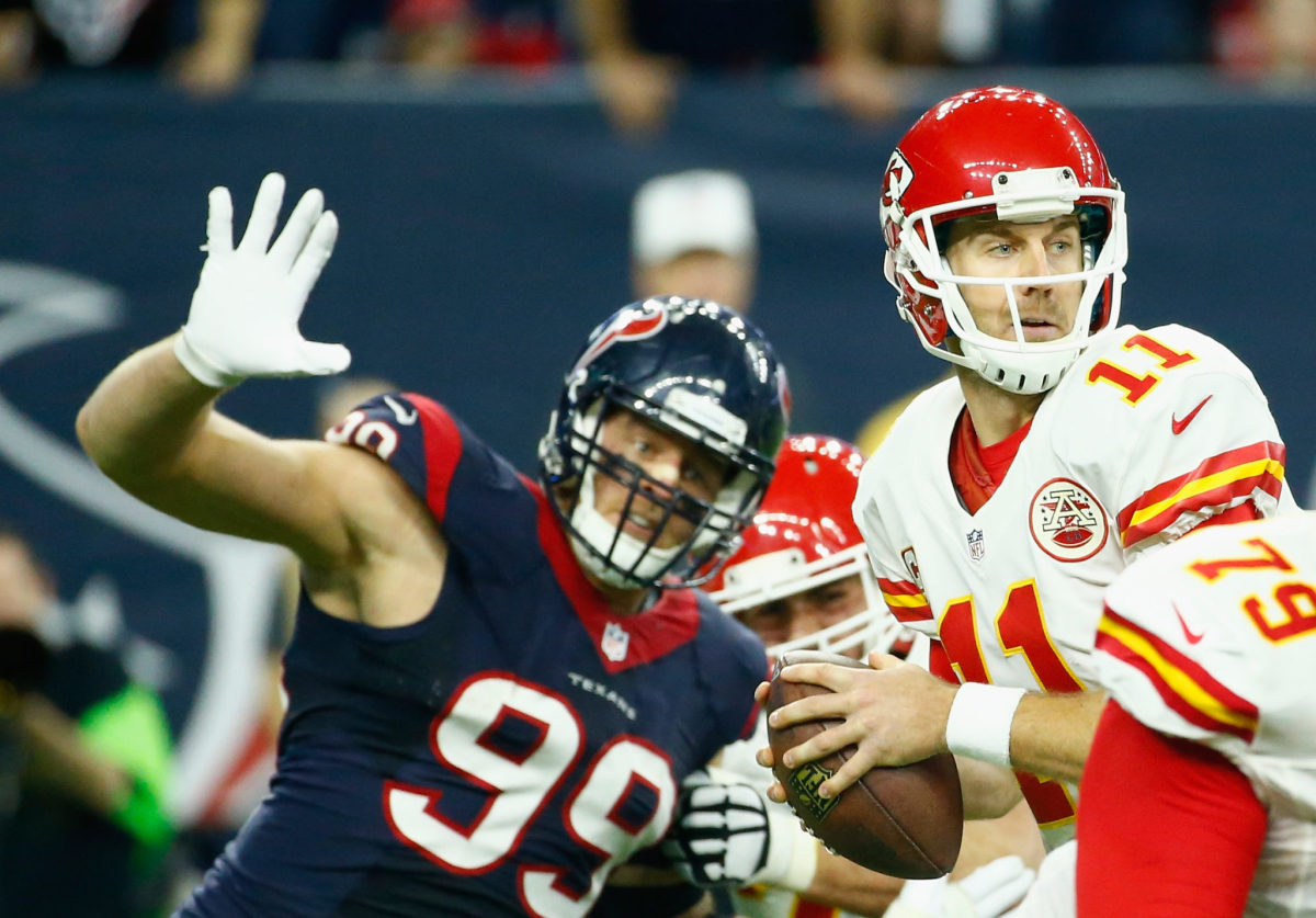 J.J. Watt comes around the edge to try and sack quarterback Alex Smith during a Texans-Chiefs game.