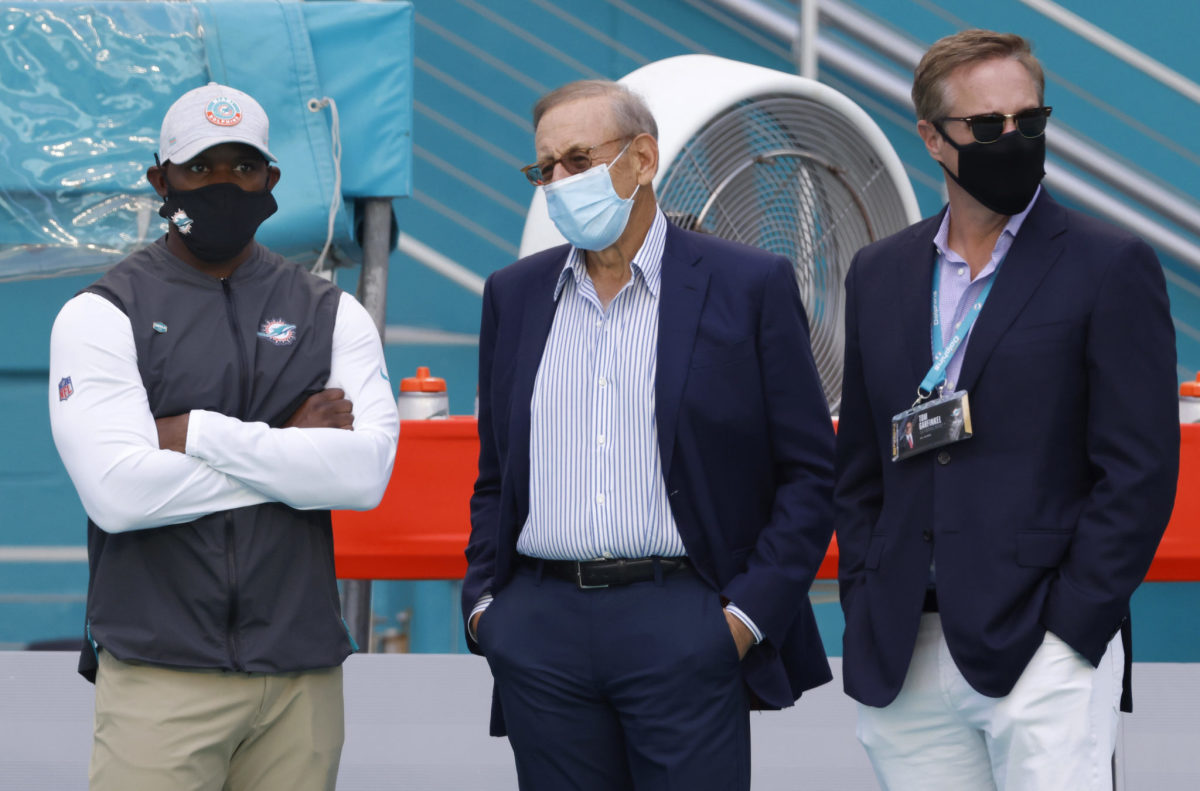 Head coach Brian Flores of the Miami Dolphins, owner Stephen M. Ross of the Miami Dolphins and CEO Tom Garfinkel of the Miami Dolphins look on during pre-game warm-up