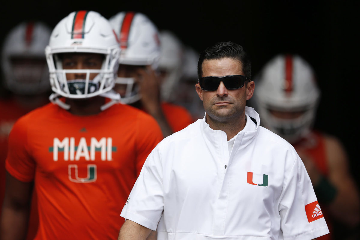 Head coach Manny Diaz of the Miami Hurricanes takes the field