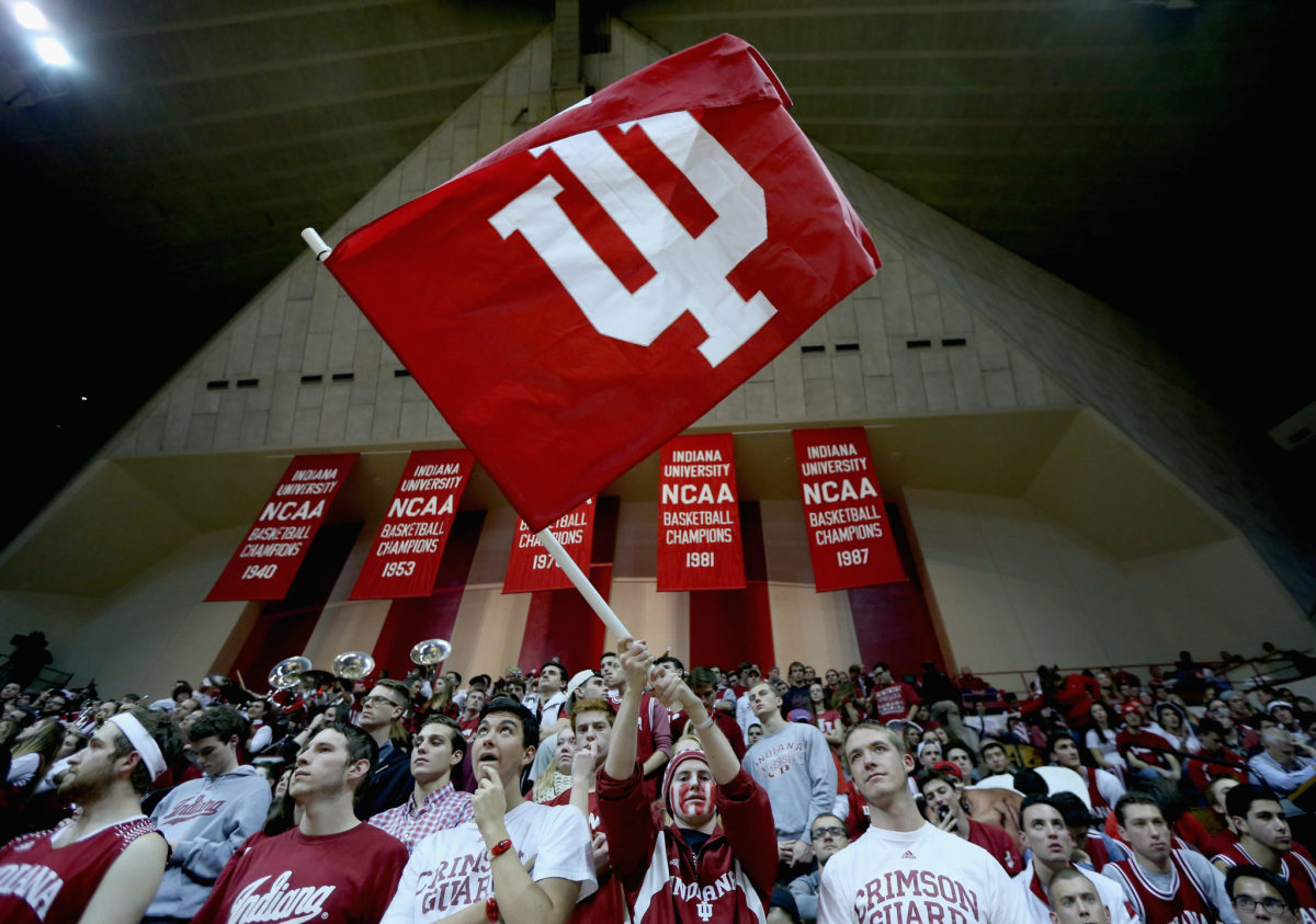 Indiana Hoosiers fans cheering at a basketball game.