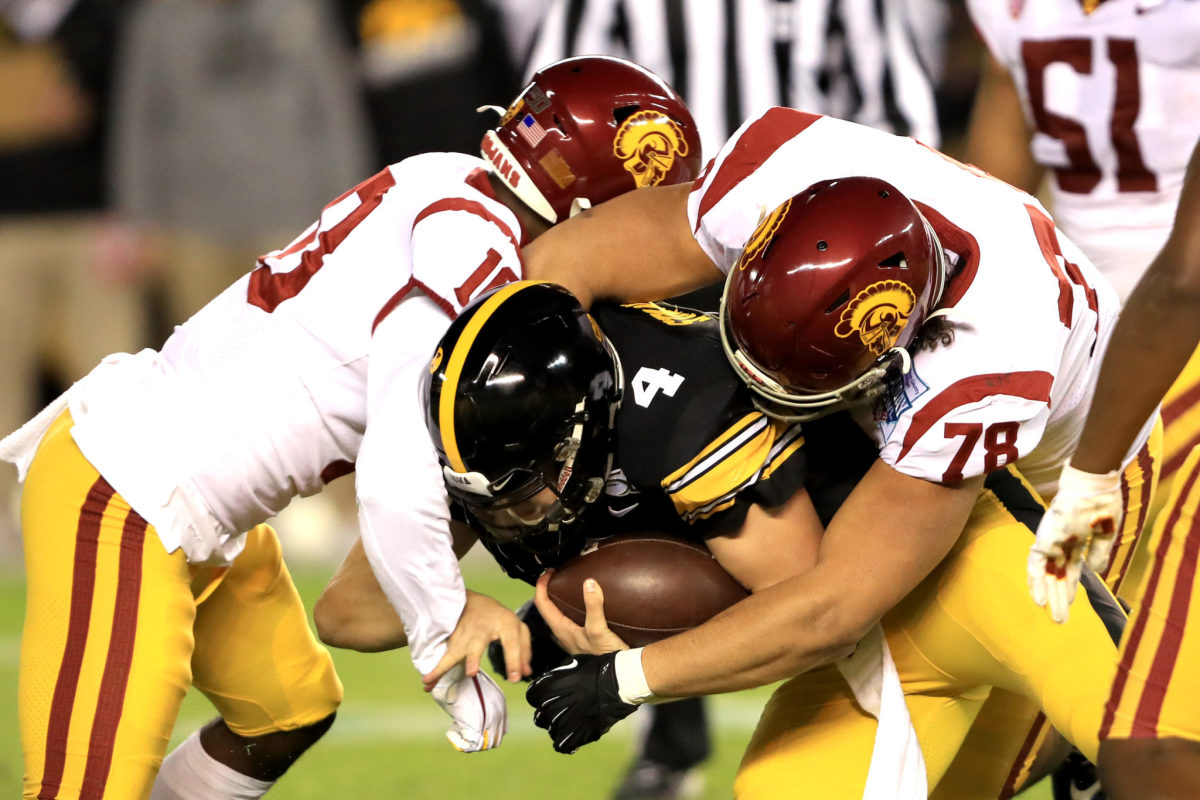 Jay Tufele makes the tackle for USC.