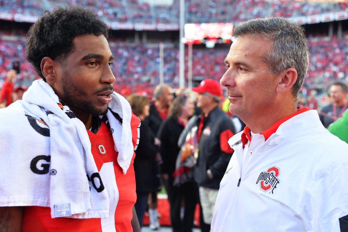 Braxton Miller talking to Urban Meyer after an Ohio State football game.