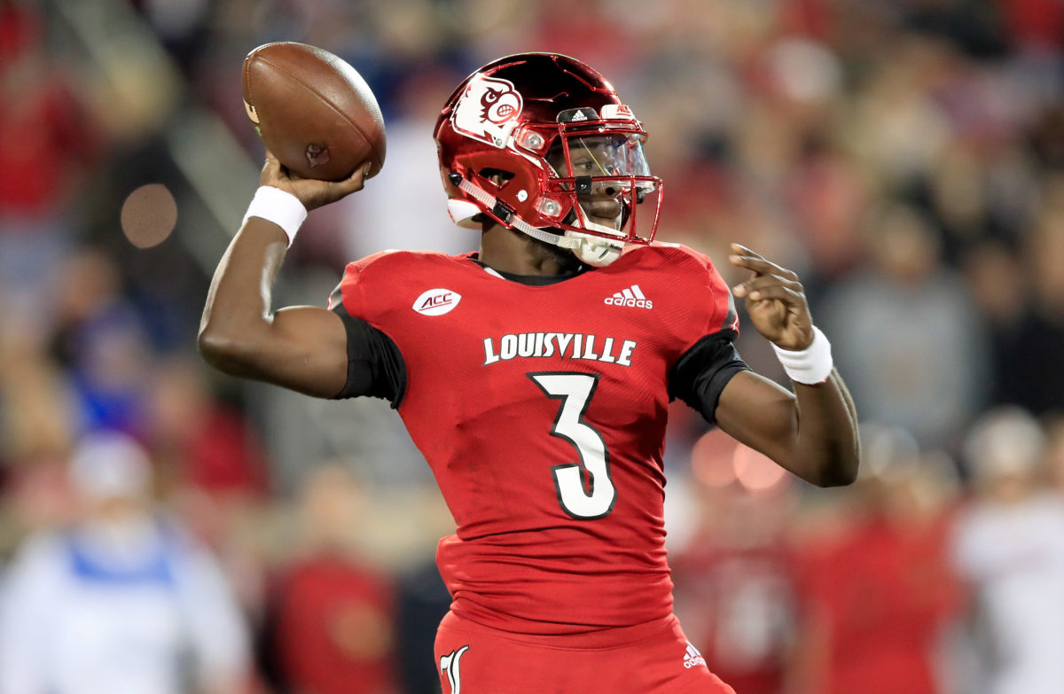 Malik Cunningham throws the ball for Louisville.