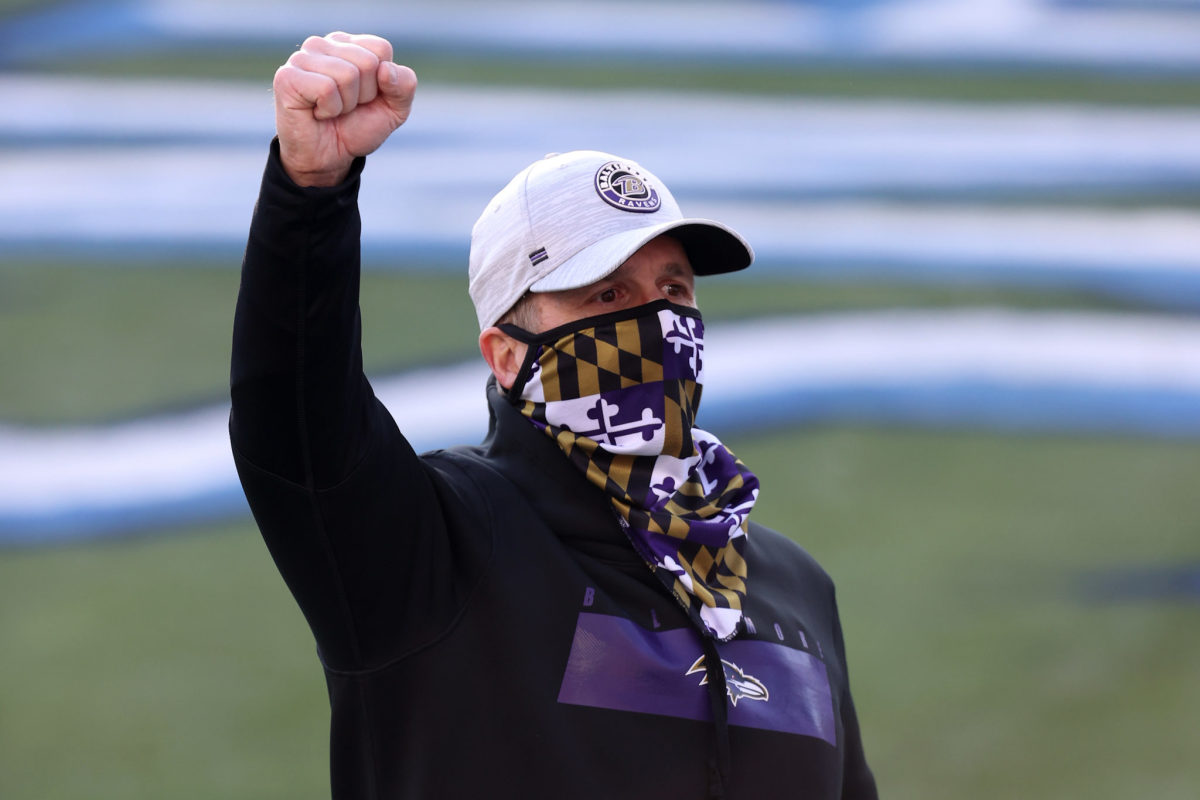 Head coach John Harbaugh of the Baltimore Ravens celebrates following their 20-13 victory over the Tennessee Titans after the AFC Wild Card Playoff game