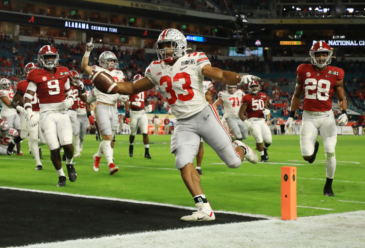 Master Teague III #33 of the Ohio State Buckeyes rushes for an eight yard touchdown