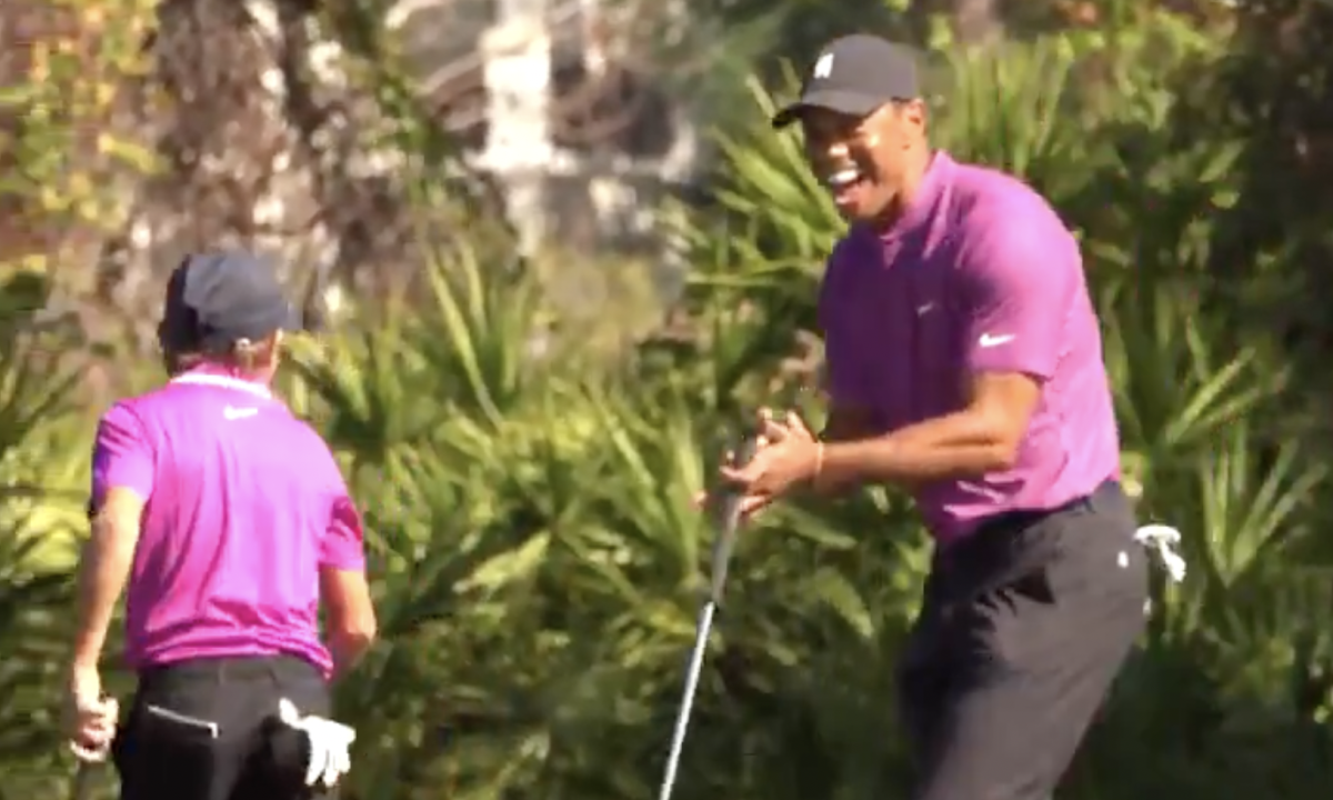 Tiger Woods reacts to Charlie Woods' shot on Saturday.