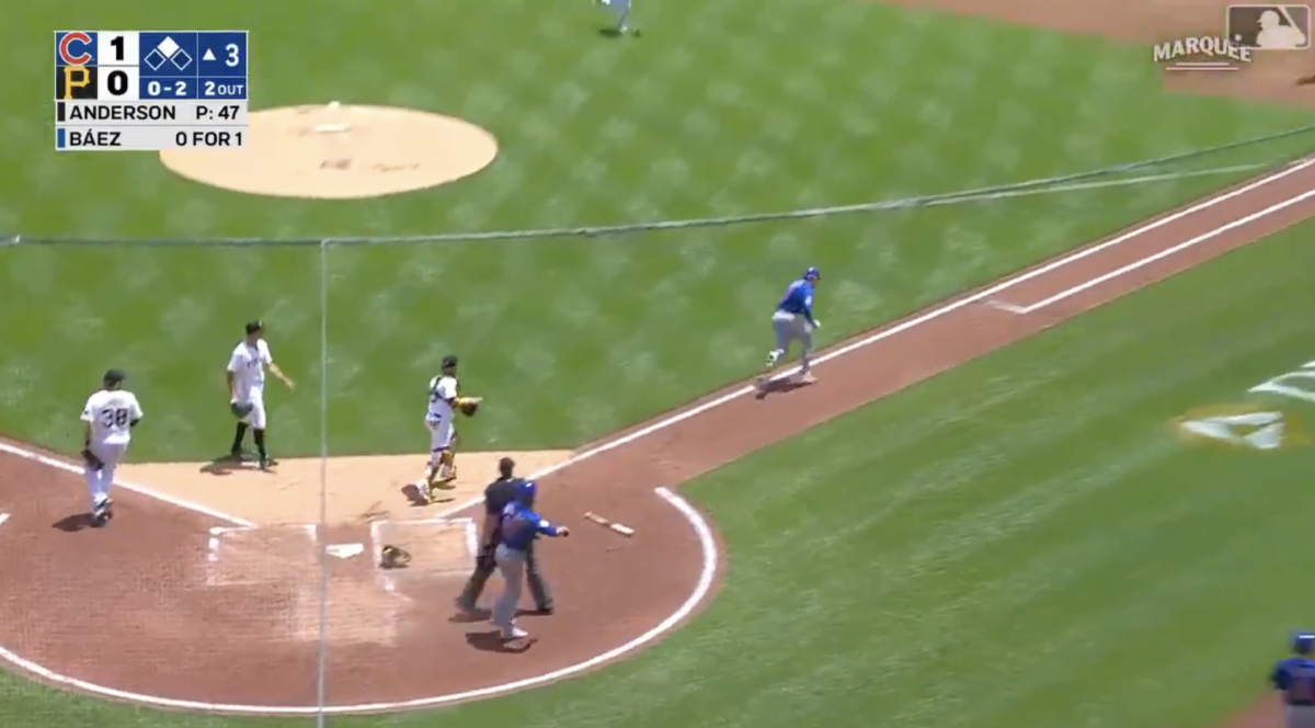 Javy Baez runs to first base.