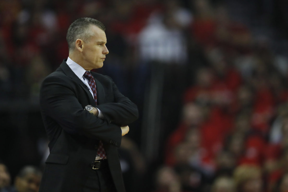 Billy Donovan crossing his arms.