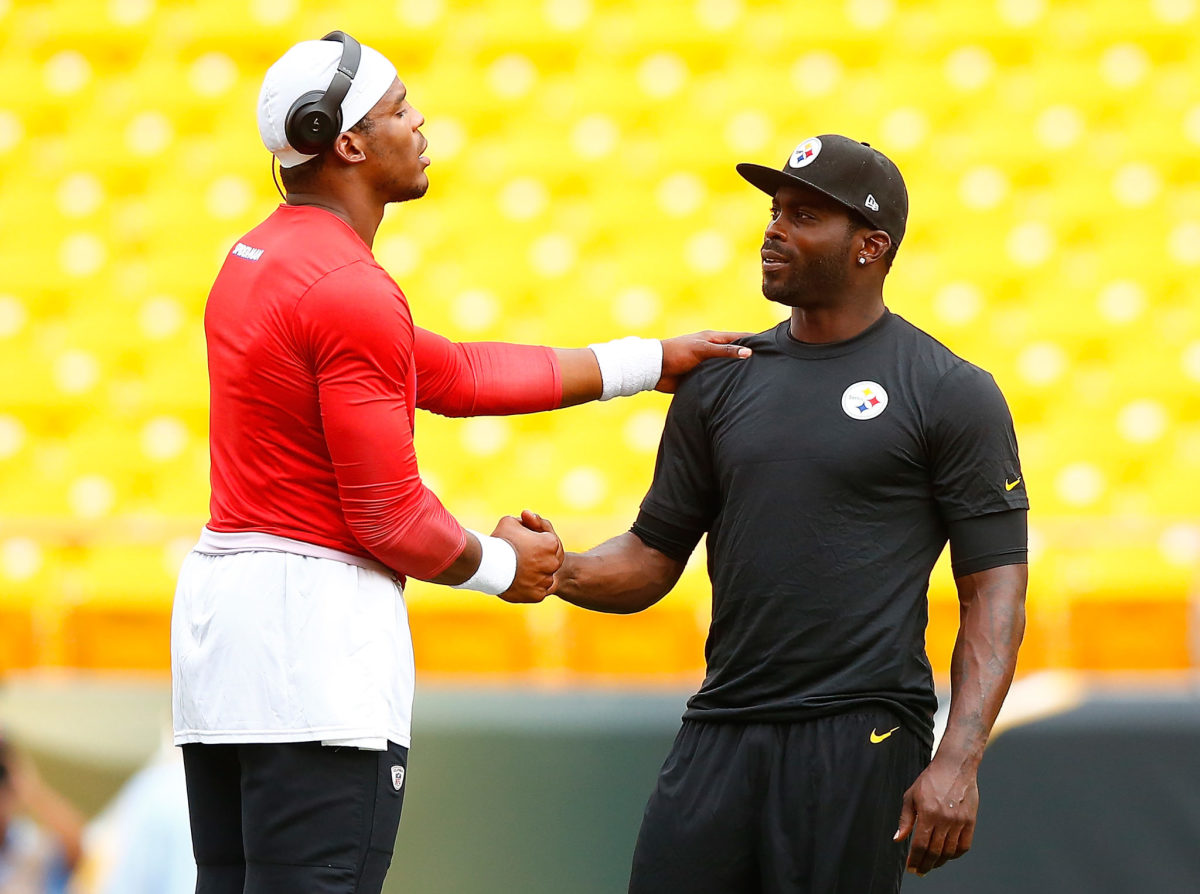 Cam Newton and Michael Vick meet before a game.