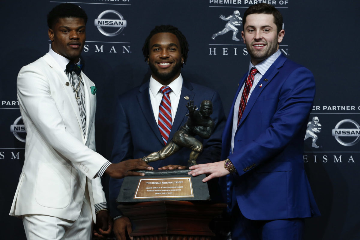 Baker Mayfield with Lamar Jackson and Bryce Love at the Heisman trophy ceremony.