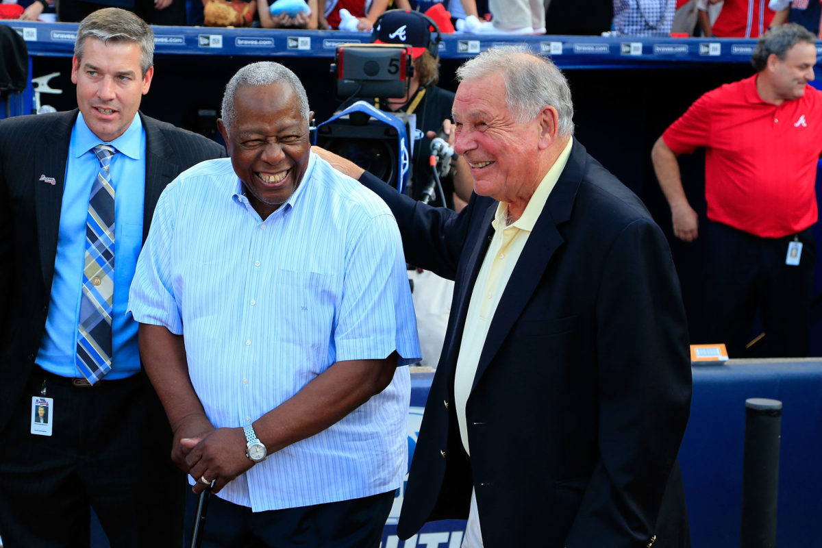 Hank Aaron and long time Atlanta Braves manager Bobby Cox laughing.