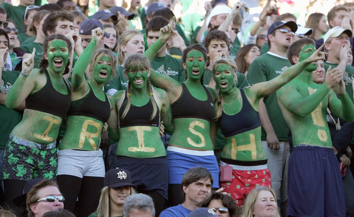 Notre Dame Irish fans with green paint all over their bodies.