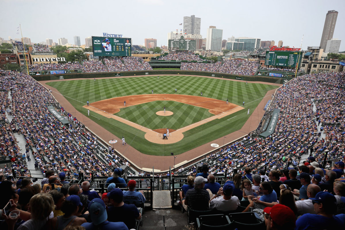 Seiya Suzuki of the Chicago Cubs hits a sacrifice fly in the first inning  of a baseball game against the Milwaukee Brewers on April 9, 2022, at  Wrigley Field in Chicago. (Kyodo)==Kyodo