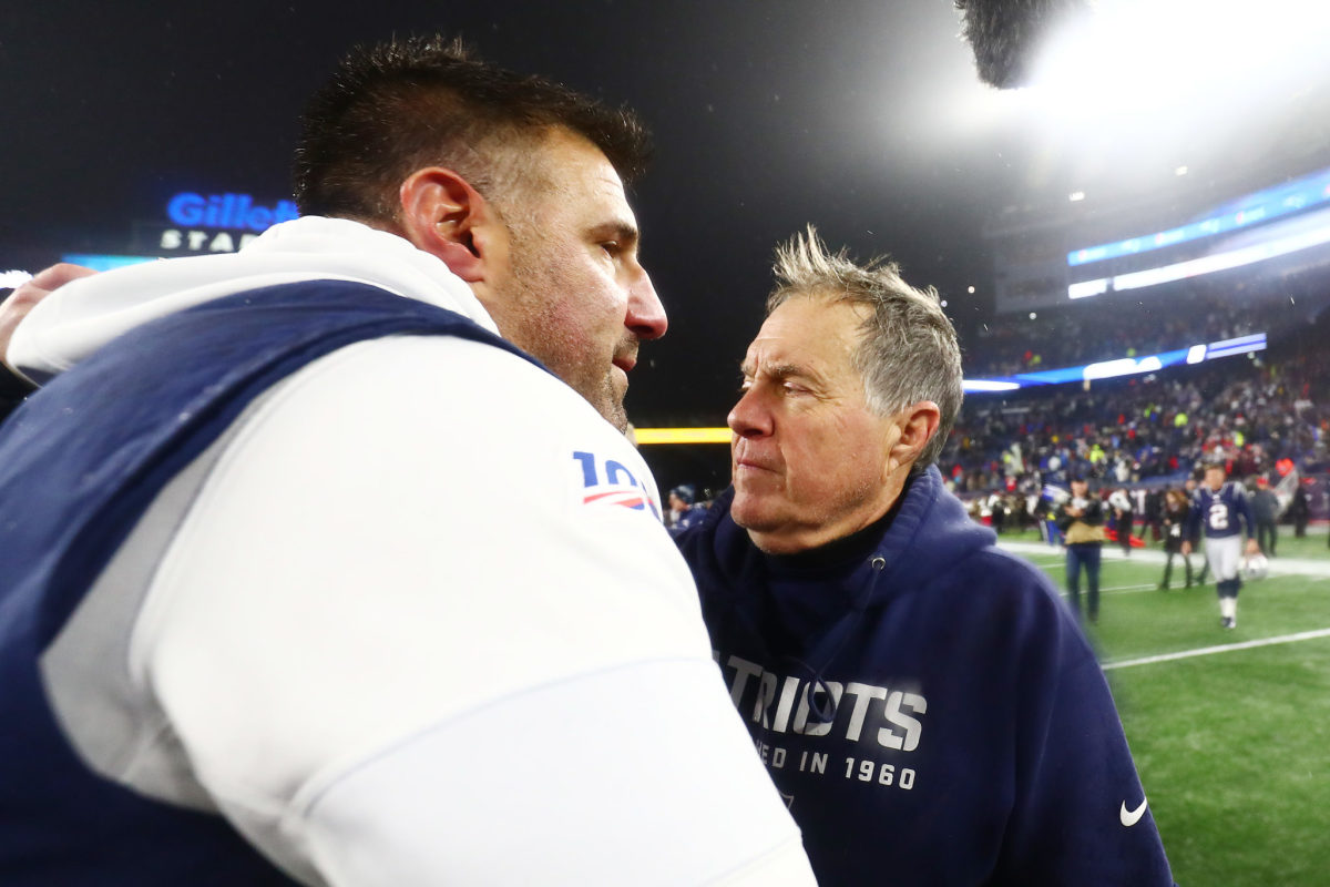 Mike Vrabel and Bill Belichick shake hands after a game.